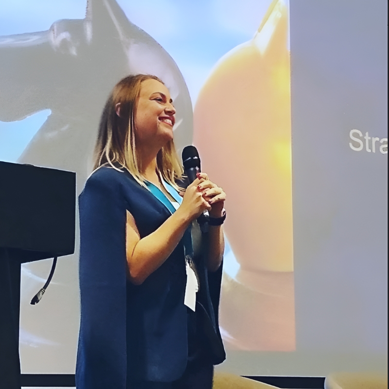 Gina Dunn speaking on stage